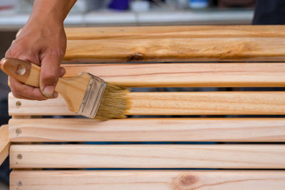 Close-up of hand holding wood