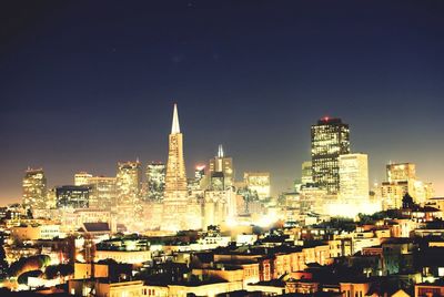 Illuminated cityscape at night