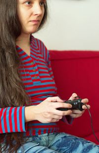 Young woman photographing with camera