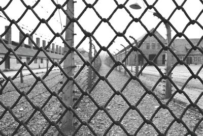 Close-up of chainlink fence against sky