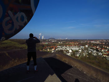 Rear view of man standing on a lookout