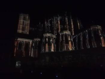 Low angle view of illuminated candles in temple