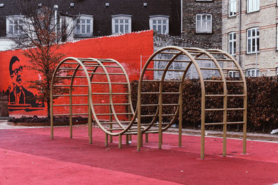 Red metallic structure on building by street