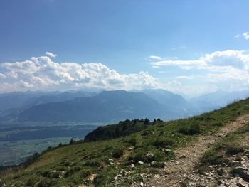 Panoramic shot of countryside landscape against mountain range