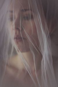 Close-up of young woman wearing veil