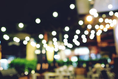 Defocused image of illuminated city at night
