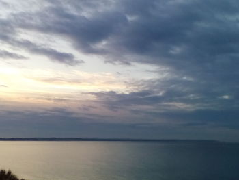 Scenic view of sea against sky at sunset