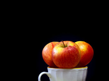 Close-up of apples on black background