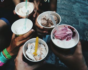 Midsection of woman holding ice cream in bowl