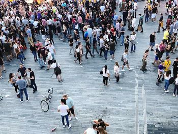 High angle view of people walking on street in city