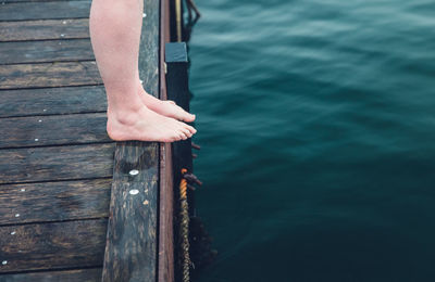 The toes of a winter bather in copenhagen denmark about to jump in