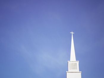 Low angle view of built structure against blue sky