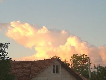 Low angle view of building against sky during sunset