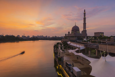 Panoramic view of buildings against sky during sunset