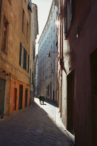 Narrow street amidst buildings in town