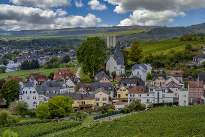 Buildings in town against sky