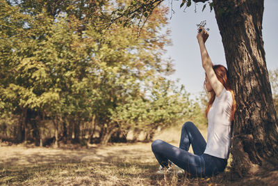 Woman sitting on field