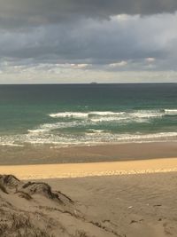 Scenic view of beach against sky