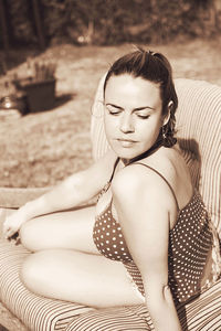 Young woman sitting outdoors