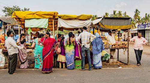 Group of people on street in city