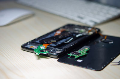 High angle view of smart phone on table