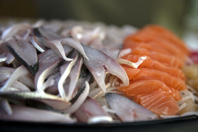 Close-up of chopped fish in plate on table