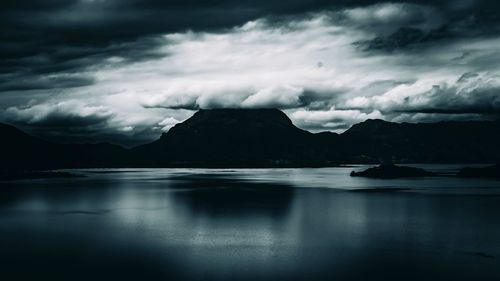 Scenic view of sea against cloudy sky