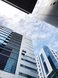 Low angle view of modern buildings against sky