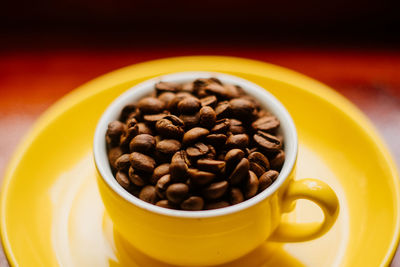 Close-up of roasted coffee beans on table