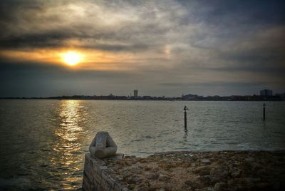 Scenic view of sea against cloudy sky