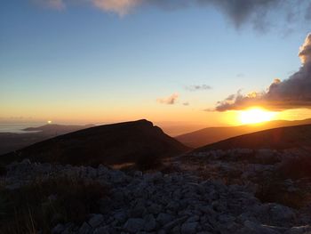 Scenic view of mountains at sunset