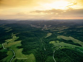 Aerial view of landscape against sky during sunset