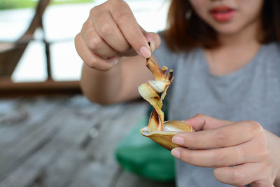 Close-up of woman holding ice cream