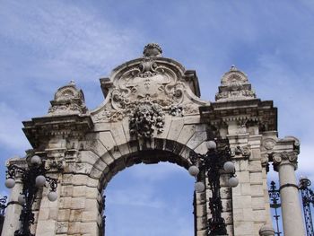 Low angle view of statue against sky