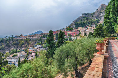 View over the city centre from the beautiful public garden of taormina, sicily, italy