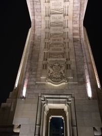 Low angle view of statue at night