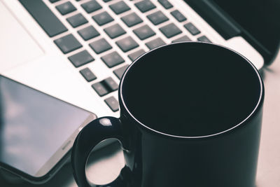 Close-up of coffee cup on table