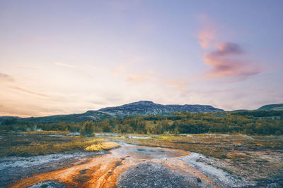 Scenic view of mountains against sky during sunset