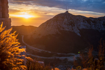 Scenic view of mountains against sky during sunset