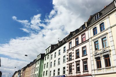 Low angle view of building against cloudy sky