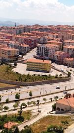 High angle view of buildings in city against sky