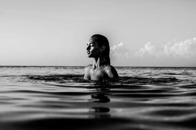 Portrait of woman swimming in sea