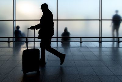 Silhouette people walking at airport