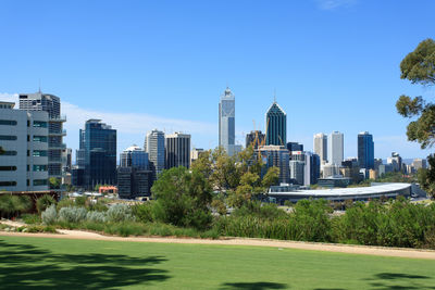 Low angle view of city against cloudy sky