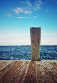 View of wooden pier on sea