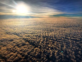 Scenic view of land against sky during sunset