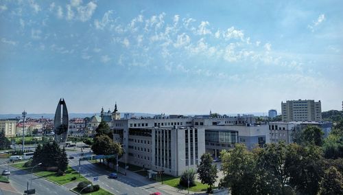 High angle view of city against blue sky