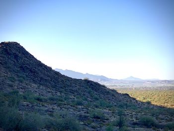 Scenic view of mountains against clear blue sky