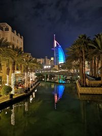 Illuminated buildings in city at night