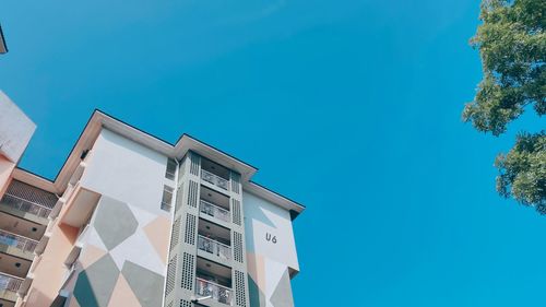 Low angle view of building against blue sky